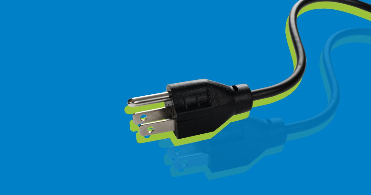 Electrical plug featuring ground lead with a green glow around it, on a blue background